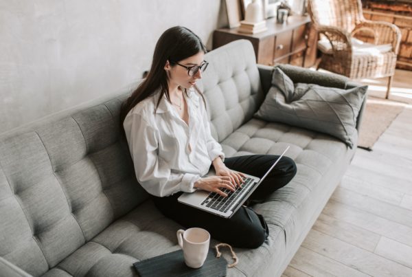 Woman Working At Home Using Laptop